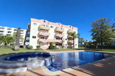 a building with a swimming pool in front of a building at Protea 214-CleverDetails, Located in heart of Vilamoura Sleeps 2 adults, 1child in Vilamoura