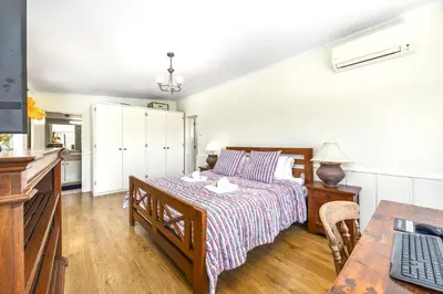 a bedroom with a bed and a desk with a keyboard at Private Oasis in Algarve with Pool & Fruit Garden in Loulé