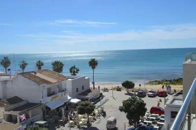 a view of the beach from a building at Duplex Varandas Do Mar Patricia Vista Mar - 50 metros Praia Olhos de Água in Albufeira