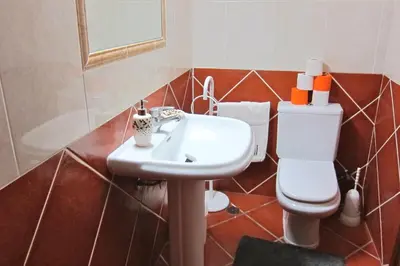 a bathroom with a sink and a toilet at 5 Bedroom Private Villa Tenazinha III, pool, garden, BBQ in Albufeira