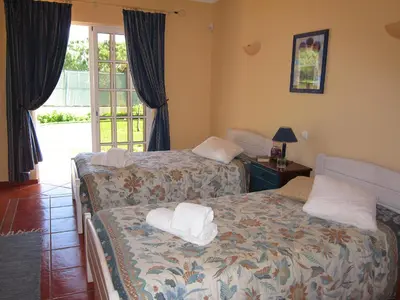 a bedroom with two beds with towels on them at 5 Bedroom Private Villa Tenazinha III, pool, garden, BBQ in Albufeira