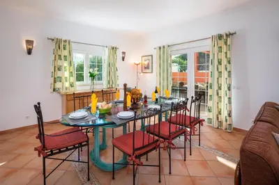 a dining room with a table and chairs at GR 2 X Private Villas Private Pools - Up to 20 Guests in Albufeira