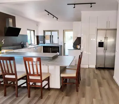 a kitchen with a large dining room table and chairs at 6 Bedroom Private Villa Tenazinha I, with private pool in Albufeira
