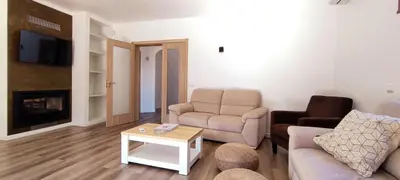 a living room with a couch and a table at 6 Bedroom Private Villa Tenazinha I, with private pool in Albufeira