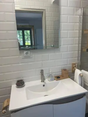 a bathroom with a white sink and a mirror at Quinta Verde Albufeira in Albufeira