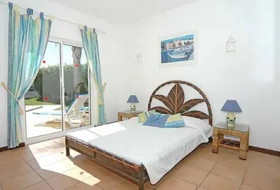 a bedroom with a bed and a large window at Charming Albufeira Villa Villa Gale Gwenda 3 Bedrooms Close To Beach in Albufeira