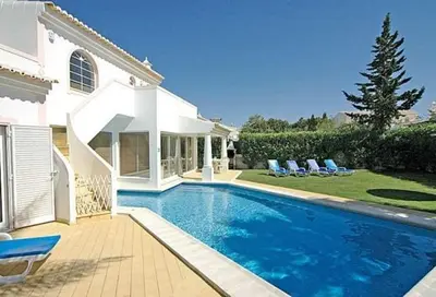 a swimming pool in the backyard of a house at Charming Albufeira Villa Villa Gale Gwenda 3 Bedrooms Close To Beach in Albufeira