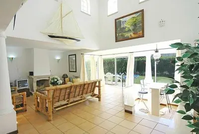 a large living room with a couch and a fireplace at Charming Albufeira Villa Villa Gale Gwenda 3 Bedrooms Close To Beach in Albufeira