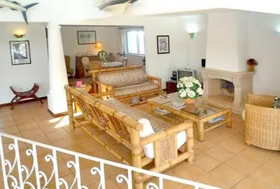 a living room with couches and a fireplace at Charming Albufeira Villa Villa Gale Gwenda 3 Bedrooms Close To Beach in Albufeira