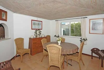 a dining room with a table and chairs at Charming Albufeira Villa Villa Gale Gwenda 3 Bedrooms Close To Beach in Albufeira