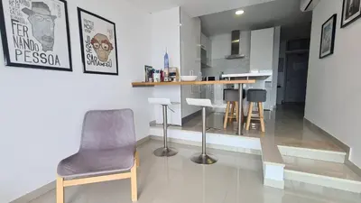 a kitchen with a table and chairs in a room at Beach lovers apartment 26 in Albufeira