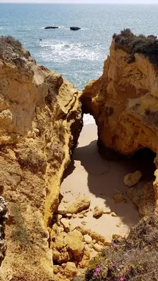 an opening in the rocks near the ocean at Beach lovers apartment 26 in Albufeira