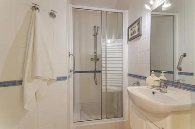a bathroom with a shower and a sink and a shower at Sail Away in Quarteira