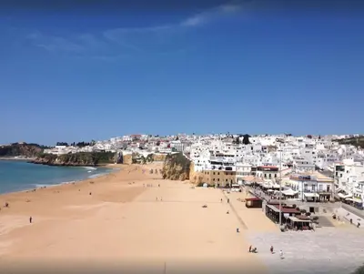 a view of a beach with white buildings at Apartamento Varandas do Mar in Albufeira
