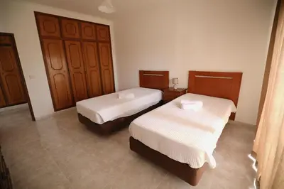 a room with two beds in a room at cantinho do mar in Albufeira