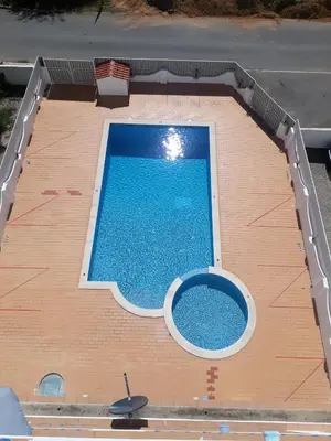 an overhead view of a large swimming pool at cantinho do mar in Albufeira