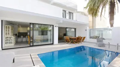 a house with a swimming pool in front of a house at Marina Parque 211-CleverDetails, Located in the Marina, Private Pool in Vilamoura