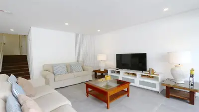 a living room with a couch and a tv at Marina Parque 211-CleverDetails, Located in the Marina, Private Pool in Vilamoura