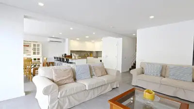 a living room with two white couches and a table at Marina Parque 211-CleverDetails, Located in the Marina, Private Pool in Vilamoura