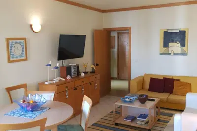 a living room with a couch and a table at Vilamoura Marina Extraordinary 70 m2 T1, Marina 200m , beach 300m in Vilamoura