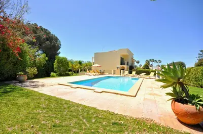 a bathroom with a toilet and a sink and a shower at A stylish villa with a private pool, short drive from the centre, free AC Wifi in Quarteira