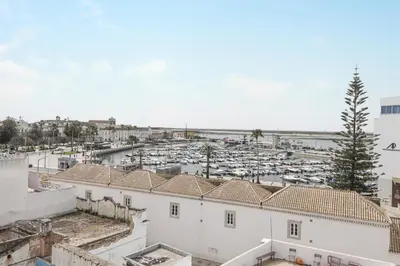 an aerial view of a parking lot with white buildings at Panoramic Faro Apartment in Faro