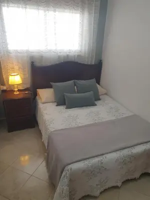 a bedroom with two beds and a window at Sunset Seaviews Albufeira in Albufeira