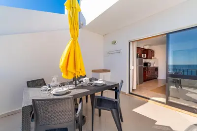 a bathroom with a toilet and a sink at Sunset Azul - Sea View - Free Wifi - By Bedzy in Albufeira