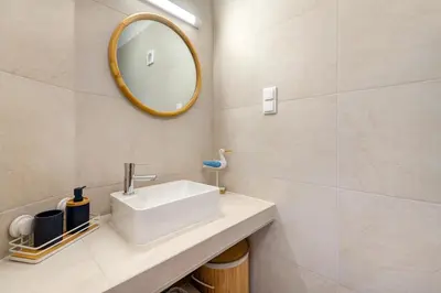 a small bathroom with a toilet and a sink at Sunset Azul - Sea View - Free Wifi - By Bedzy in Albufeira