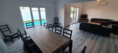 a dining room with a wooden table and chairs at Large Villa - Private Pool - 6 Bedrooms in Albufeira