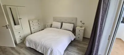 a small bedroom with a bed and a window at Large Villa - Private Pool - 6 Bedrooms in Albufeira