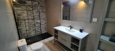 a bathroom with a sink and a mirror and a shower at Large Villa - Private Pool - 6 Bedrooms in Albufeira