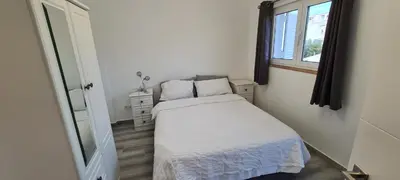 a bedroom with two beds and a large window at Large Villa - Private Pool - 6 Bedrooms in Albufeira