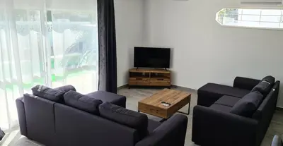 a living room with two couches and a television at Oura - Large Villa - Private Pool - 5 Bedrooms in Albufeira