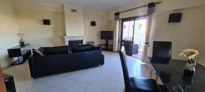 a living room with a couch and a fireplace at 401 - 2 bedroom Apartment - Oura - Sea View in Albufeira