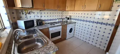 a small kitchen with a sink and a microwave at 401 - 2 bedroom Apartment - Oura - Sea View in Albufeira