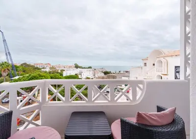 a balcony with chairs and a view of the city at 402 - Oura - 2 Bedroomed Apartment - Sea View in Albufeira