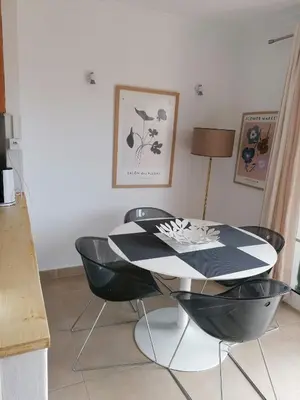 a kitchen with chairs and a table in a room at Old Village Vilamoura in Quarteira