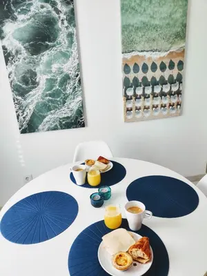 a table topped with plates of breakfast foods and drinks at Casa Sequeira in Albufeira