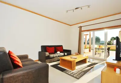 a living room with two couches and a coffee table at Townhouse Mar 2 by Algarve Vacation in Albufeira