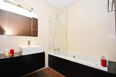 a bathroom with a sink and a glass shower at Townhouse Mar 2 by Algarve Vacation in Albufeira
