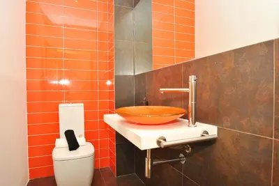 a bathroom with a bowl sink and a toilet at Townhouse Mar 2 by Algarve Vacation in Albufeira