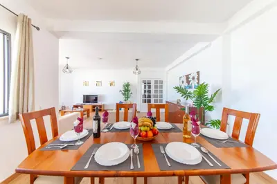 a dining room table with a bowl of fruit on it at Villa Abel by Algarve Vacation in Albufeira