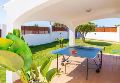 a ping pong table in the backyard of a house at Villa Abel by Algarve Vacation in Albufeira