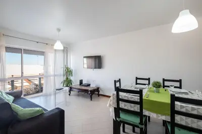a bedroom with a white bed and a mirror at #012 Exclusivo para Famílias, Habijovem by Home Holidays in Albufeira