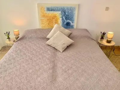 a bed with two pillows on it in a bedroom at Villa Amendoeiras 52 in Albufeira