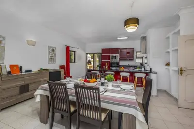 a living room with a couch and a table at Villa Aldeia by Villa Plus in Albufeira