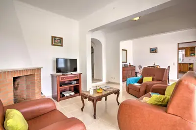 a living room with two couches and a fireplace at Villa Miguel by Villa Plus in Galé