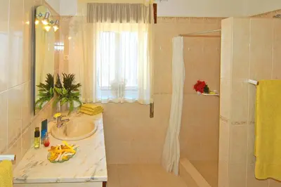 a bathroom with a sink and a shower at Villa Miguel by Villa Plus in Galé