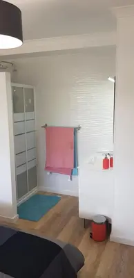 a room with a bathroom with a sink and a mirror at New Grand duplex avec terrasse plein sud vue piscine in Vilamoura